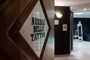 Фотография Needle Bells Tattoo 3